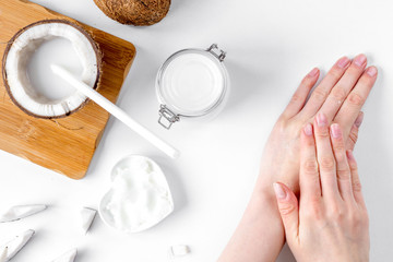 organic cosmetics with coconut on white background top view