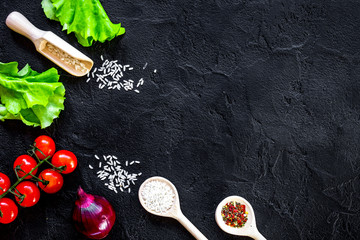 ingredients for paella on dark background top view