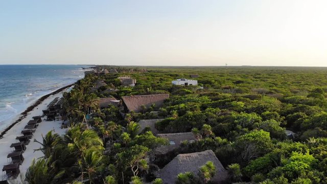 Flying over the rainforest at Tulum beach at sunset, Quintana Roo, Mexico
