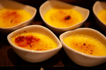 Creme brulee, also known as burnt cream, crema catalana or Trinity cream, a rich and velvety custard base topped with a contrasting layer of hard and crunchy caramel.