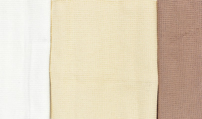Closeup Multicolored clean towels. Texture of cotton, waffle towel, textiles. Towels for kitchen or Spa concept.