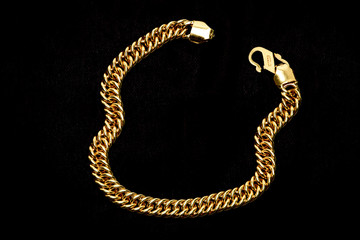 Golden chain on a dark pattern
