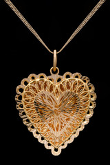 Modern golden pendant on a dark pattern