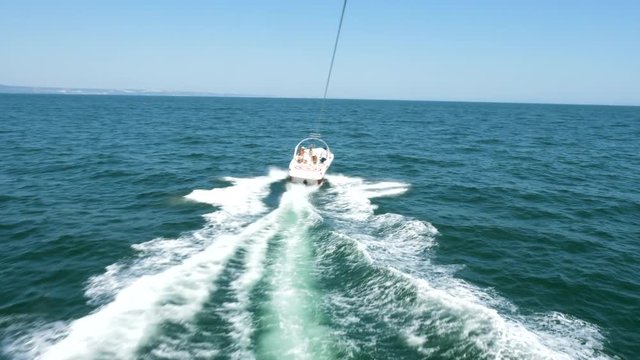 POV footage of parasailing over the sea. Extreme sport. Active holiday
