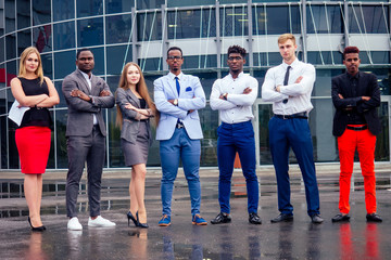 a group of multinational people businesswoman and business man at a business meeting communicating against the background of office windows on the street. teamwork concept