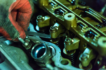 Maintenance check and adjust valve lash in car engine