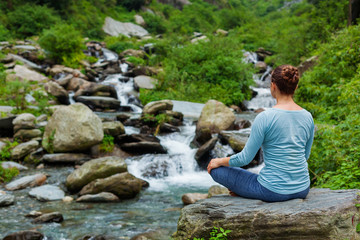 Woman in Padmasana outdoors
