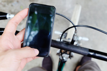 Cyclist using smartphone