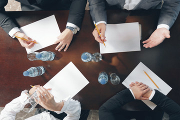 Group of busy business people working in office, top view