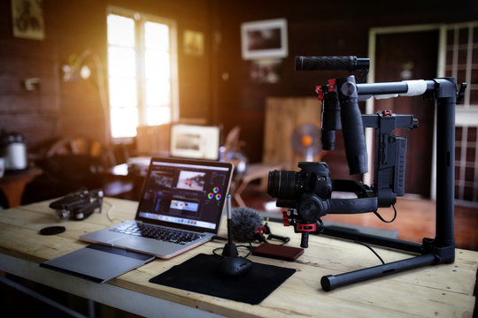 Vlogger equipment for Filming a movie or a video blog Drone Steadicam Camera Stabilizer and laptop.