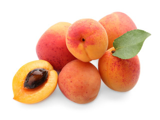 Ripe sweet apricots on white background