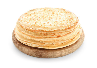 Wooden board with stack of tasty thin pancakes on white background