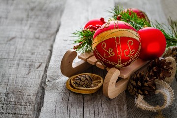 Colorful christmas decorations on rustic wood background