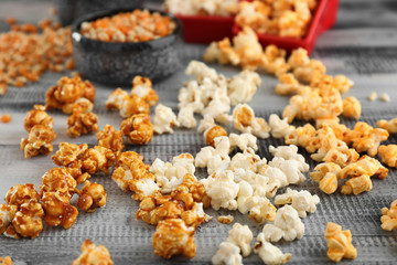 Delicious popcorn on wooden background
