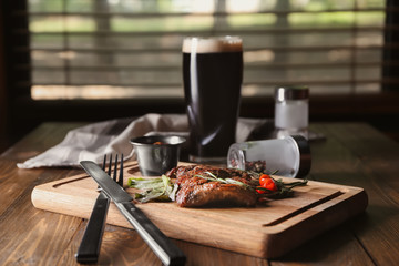 Delicious grilled steak on wooden board