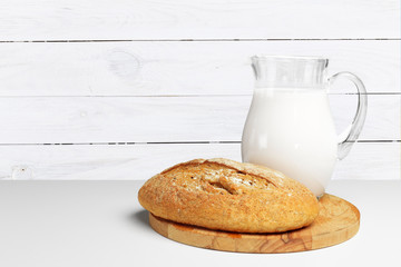 Bread and milk on the table
