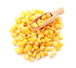 Scoop with tasty corn kernels on white background