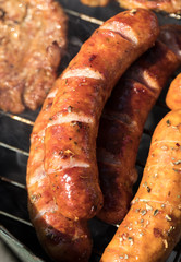 Unhealthy but tasty grilled sausages and meat
