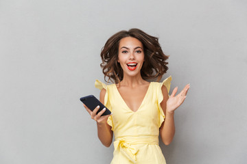 Portrait of a cheerful young girl in dress
