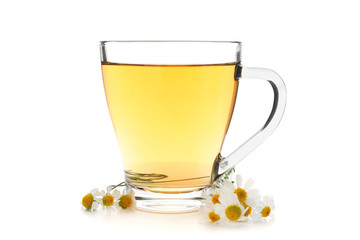 Glass cup of delicious camomile tea on white background