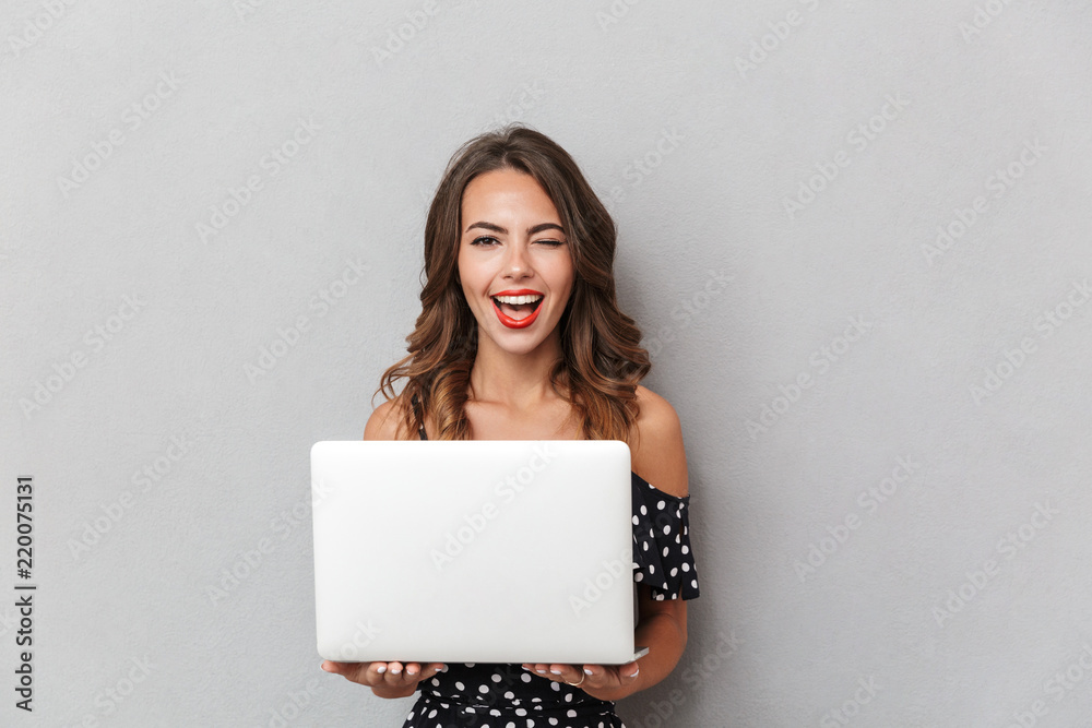 Poster Portrait of a cheerful young girl in dress