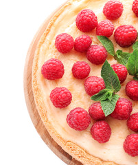Delicious cheesecake with raspberries on white background, closeup
