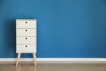 Cabinet near color wall