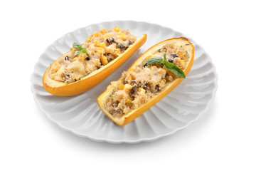 Plate with quinoa stuffed zucchini boats on white background