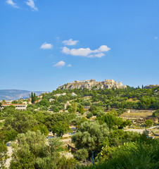 Fototapeta na wymiar North slope of the Athenian Acropolis. View from the ancient Agora of Athens. Attica region, Greece.