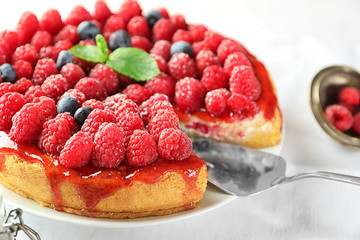 Delicious raspberry cheesecake on plate, closeup