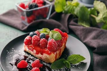 Piece of delicious raspberry cheesecake on plate, closeup