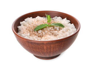 Bowl with delicious rice pudding and cinnamon powder on white background