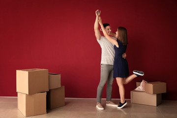Happy young couple after moving to their new house