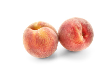 Fresh peaches on white background