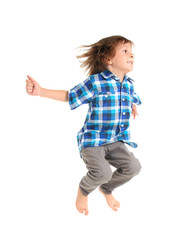 Cute little boy jumping on white background
