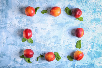 Composition with ripe peaches on color background, top view