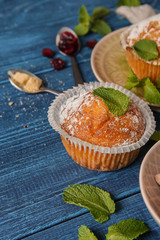 Tasty muffin on wooden table