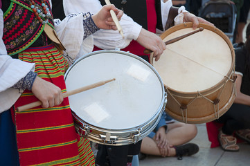 Man and woman playing the drum and wearing one of the traditional costume of Zamora, Spain
