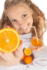 Portrait of a Young Woman Drinking Orange Juice while Showing an