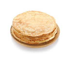 Plate with tasty thin pancakes on white background