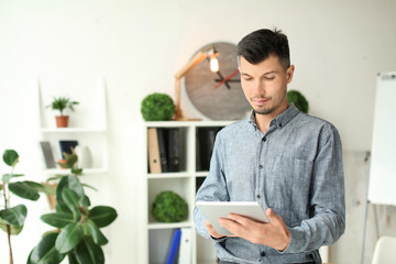 Businessman with tablet computer in office