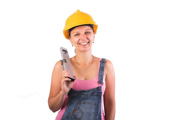 
Portrait of a young Craftsman woman with a spirit level - Woman construction worker isolated on white