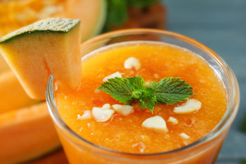 Glass of fresh melon smoothie, closeup