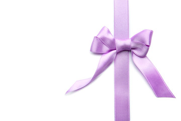 Purple ribbon with bow on white background