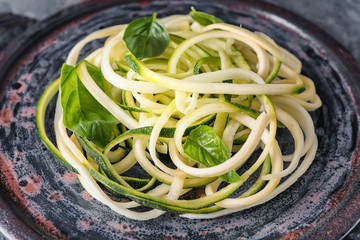 Plate with zucchini spaghetti, closeup