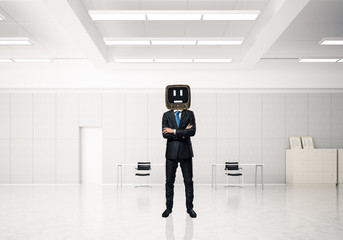 Businessman with an old TV instead of head.