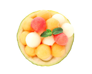 Bowl with fresh melon and watermelon balls on white background
