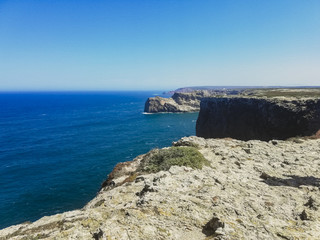Fototapeta na wymiar Ocean seen from the top of a cliff in Sagres, Portugal.
