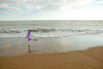 little girl on the ocean beach