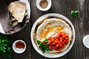 Chickpea hummus served flatbread cherry tomatoes top view
